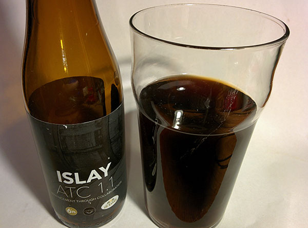 Picture of a bottle of beer called Islay ATC 1.1 poured into a glass