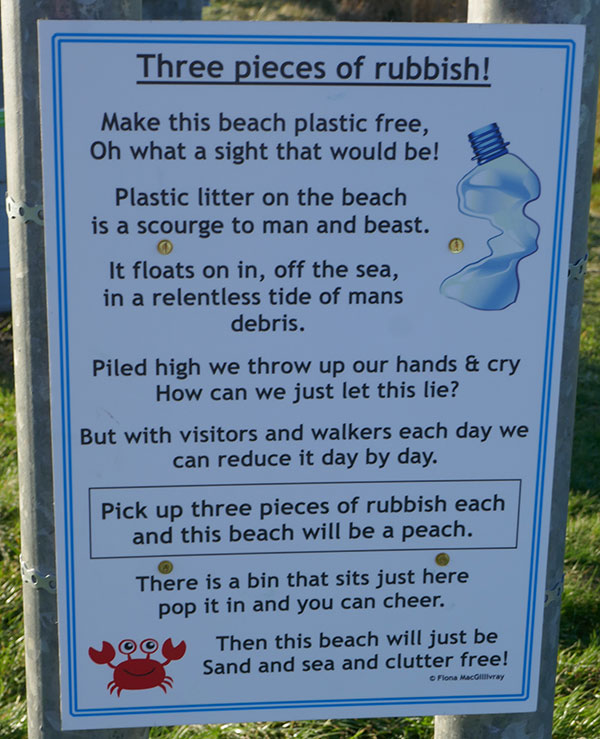 Picture of a sign with a poem encouraging people to pick up three pieces of rubbish from a beach