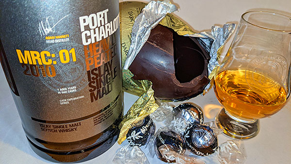 Picture of a Bruichladdich Port Charlotte MRC: 01 2010 with a Lindt dark chocolate Easter egg and cocoa truffles