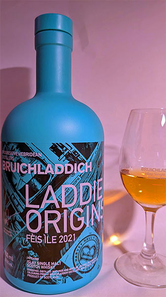 Picture of a bottle and a dram of the Bruichladdich Laddie Origins Fèis Ìle 2021 Islay single malt whisky