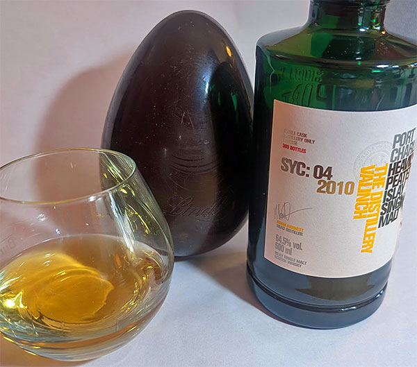 Picture of a Bruichladdich Port Charlotte valinch SYC: 04 2010 with a large chocolate Easter egg